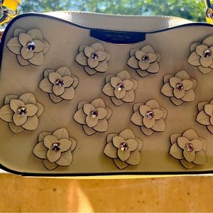 Henri Bendel cream yellow handbag w rhinstones and leather floral applique.